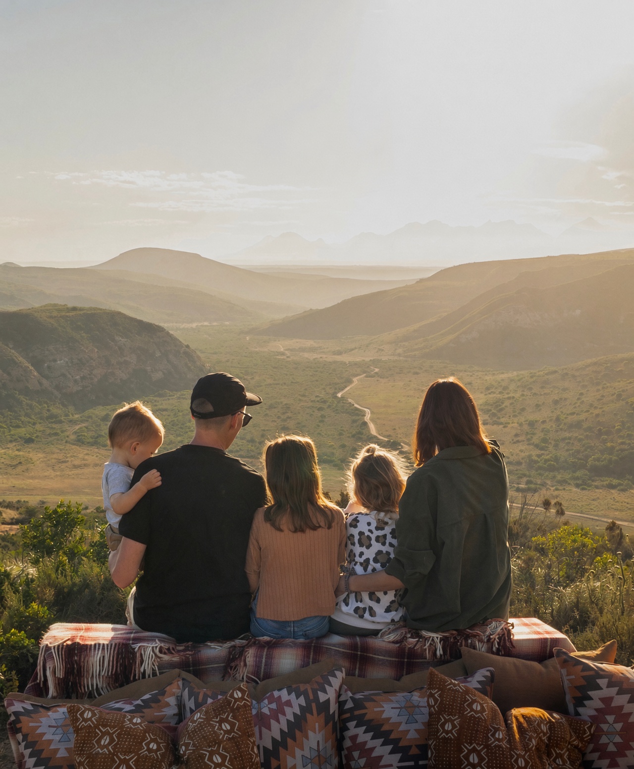 Family of five sitting together on a Bokkie Drive at Gondwana Game Reserve